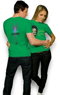 Male and Female models wearing green tshirts with custom designs on them one of Bigfoot other of spider design